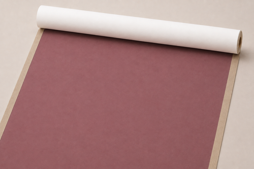 Red grey gesso-primed cotton canvas, cut to size and partly unrolled from a tube
